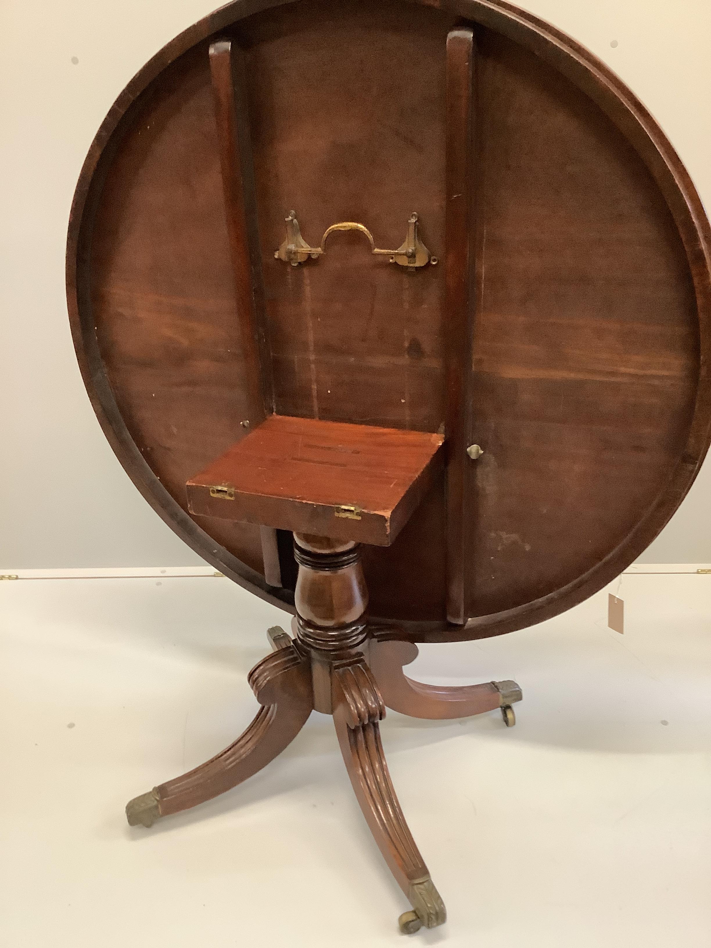 A Regency rosewood banded circular mahogany tilt top breakfast table, diameter 123cm, height 75cm
